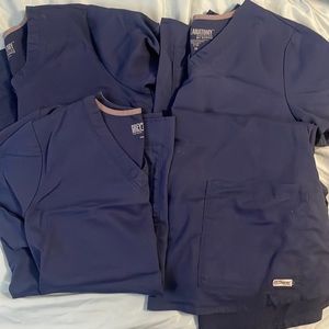 4 size M greys anatomy navy tops. lightly worn due to color change